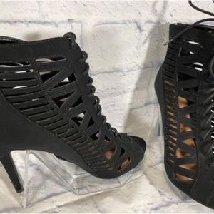 Lace up strapped ankle booties. Never worn. Black size 10. 4” heel. Zipper back